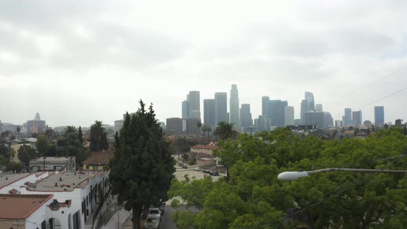 AERIAL: Echo Park Neighbourhood with View on Downtown Los Angeles on Cloudy Day