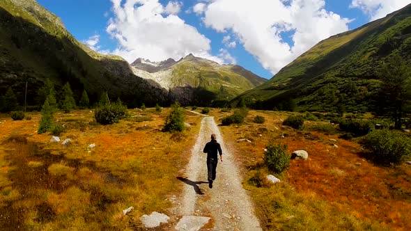 Young Caucasian Male Running on Nature Road Outdoors