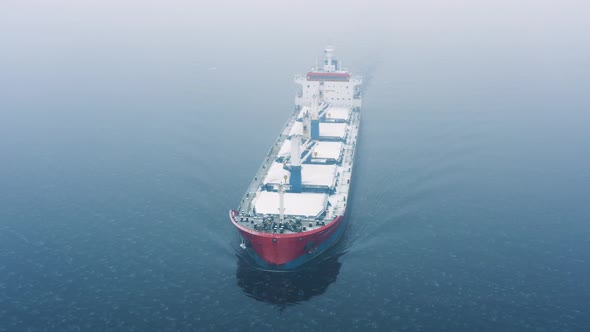 General Cargo Ship in the Sea at Winter Time
