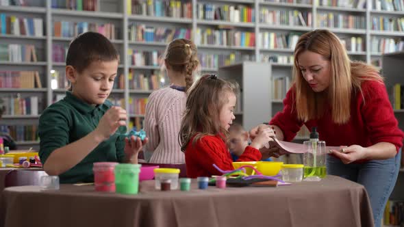 Teacher Playing Slime with Little Autistic Girl