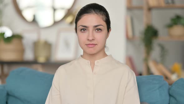 Indian Woman Looking at Camera at Home 