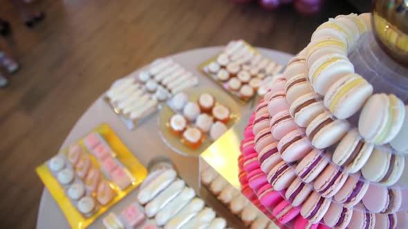 Table with Sweet Cookies, Eclairs, Cakes. Candy Bar Camera Move Down