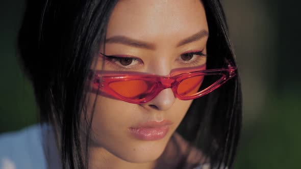 Fashion Asian Model Portrait with Creative Stylish Make-up Outdoors