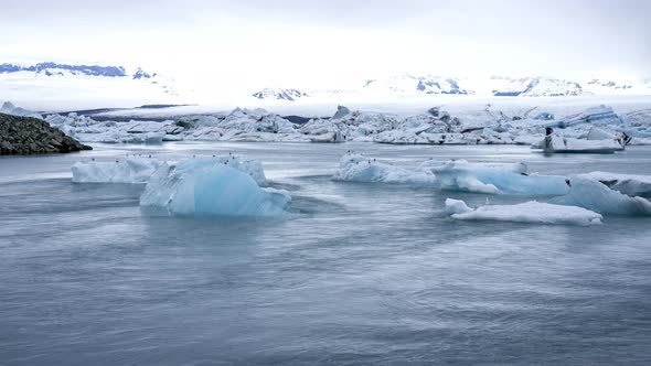 Tabular Icebergs Melt at Turquoise Ocean Bay