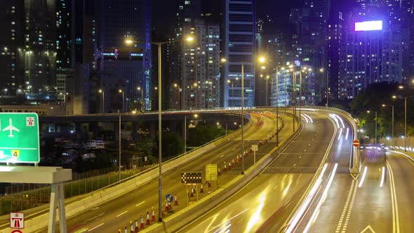 Timelapse Illuminated Hong Kong Road Against Cityscape