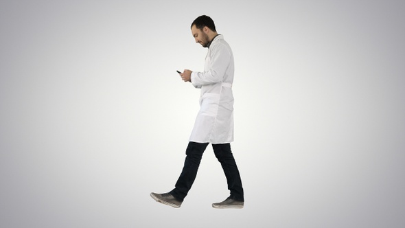 Walking medical professional using smart phone and making