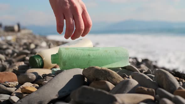 Cleaning Up Plastic on Stone Beach