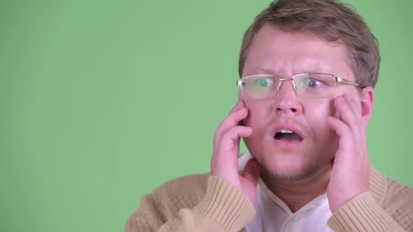 Face of Stressed Overweight Bearded Man Looking Shocked