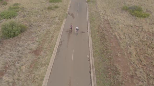 AERIAL Two Cyclists doing an UPHILL SPRINT