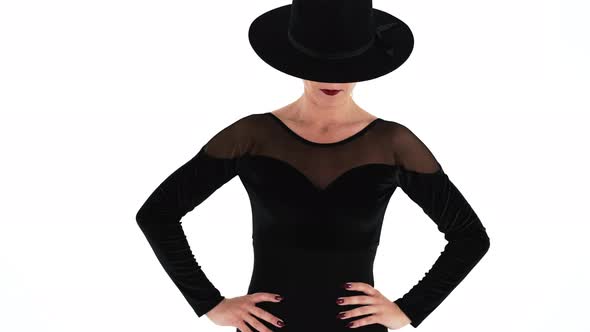 Unrecognizable Woman Posing with Black Hat on Eyes White Studio Background