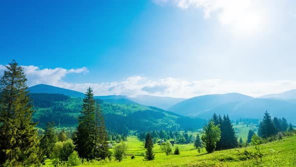 Time Lapse of Blue Sky with Clouds Over Mountain