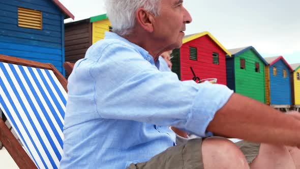 Senior couple interacting with each other at the beach