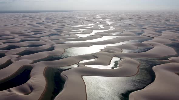 Scenic paradise with waving sand dunes and rainwater lakes of Lencois Maranhenses, Brazil.