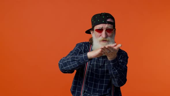 Mature Old Bearded Grandfather in Sunglasses Showing Wasting or Throwing Money Around Hand Gesture