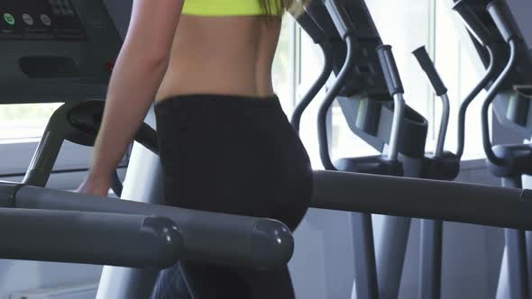 Close Up Shot of a Sexy Sportswoman with Perfect Butt Running on a Treadmill