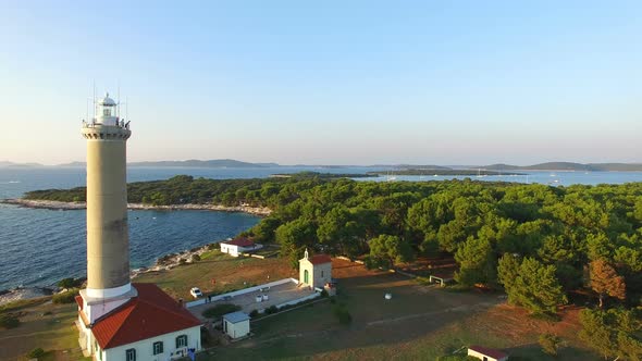 Flying over people visiting a lighthouse, Croatia