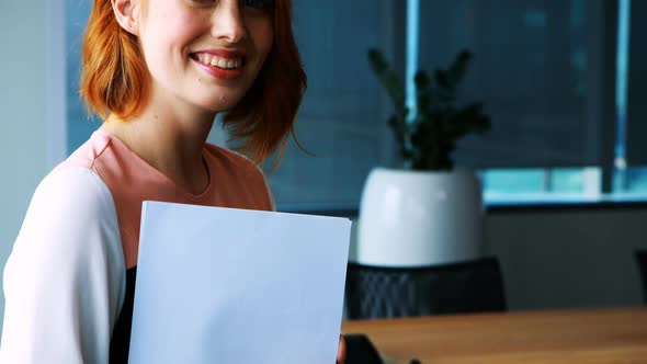 Confident female executive in office