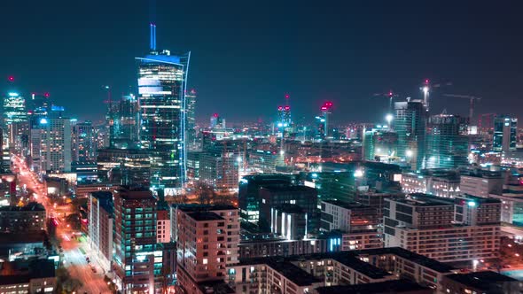 Aerial Hyperlapse of Warsaw Business Center at Night: Skyscrapers and Palace of Science and Culture