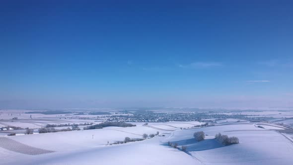 Winterly At The Vast Plains Near Zistersdorf Town In Weinviertel, Lower Austria. Aerial Wide Shot