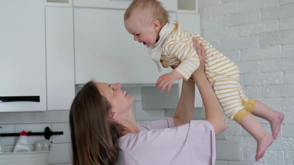 Little Infant Child Laughing Having Fun and Looking in Camera