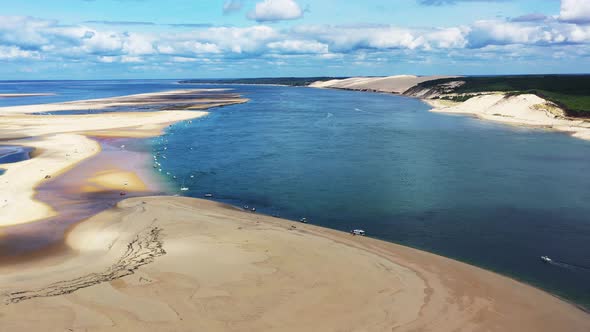 Banc d'Arguin at Arcachon Bay France with boats anchored along the coast, Aerial dolly left view