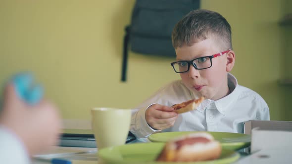 Pupil Has Dinner with Pizza By Friend with Spinner at Table