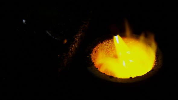 Acetylene torch melting the hot metal