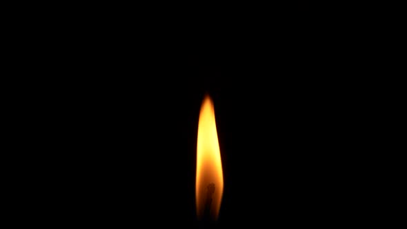 Closeup Candle Fire Flame Isolated Burning on Black Background Slow Motion