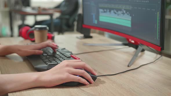 Close Up Of The Woman's Hand Video Editor Works With Footage And Sound On Her Personal Computer