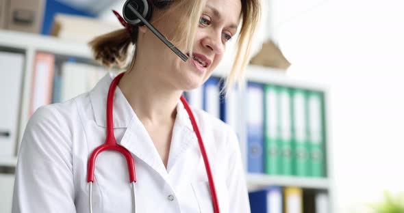 Woman Doctor Operator in Headphones with Microphone