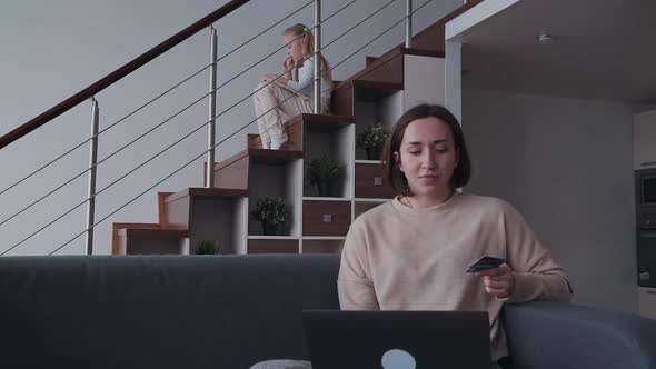 Woman Making Online Shopping Using Laptop and Bank Card