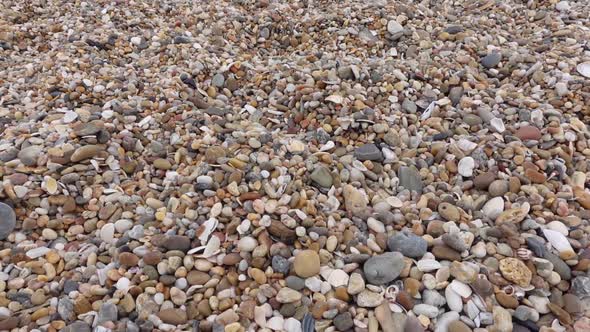 Moving Over Beach Pebbles
