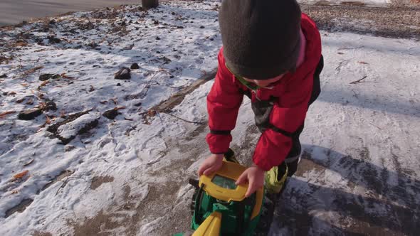 Boy Pushing A Toy Car