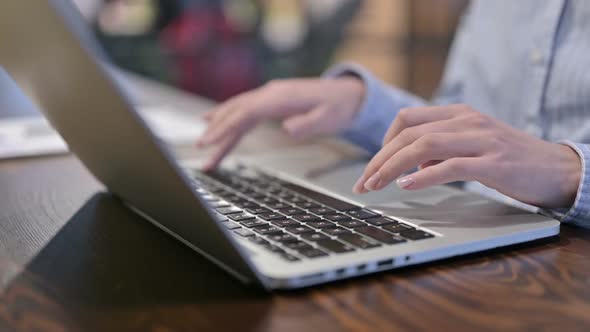 Close Up of Female Hands Typing on Laptop
