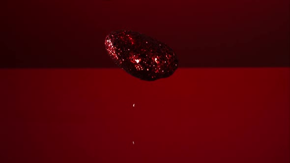 Decorations falling, bouncing in ultra slow mo 1500fps - reflective surface - VALENTINES PHANTOM 004