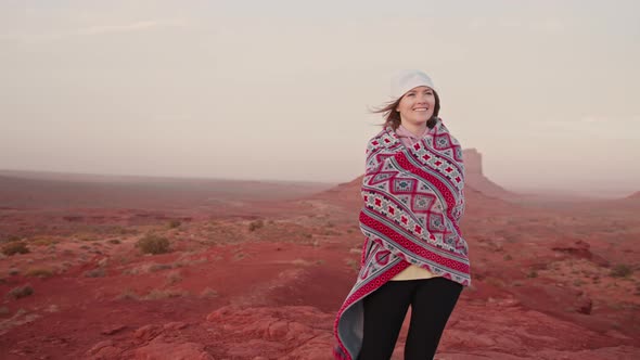 Portrait of Beautiful Young Woman Smiling Charmingly in Red Desert Landscape