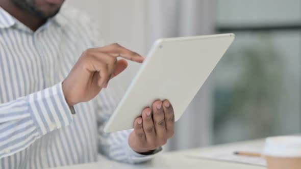 Close Up of African Man Working on Digital Tablet