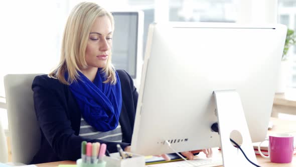 Portrait of businesswoman using computer