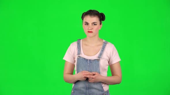 Girl Listens with Approval and Shows a Like Sign on Green Screen