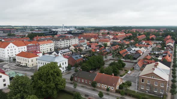 Township with colorful buildings of Ystad, fast flying aerial view