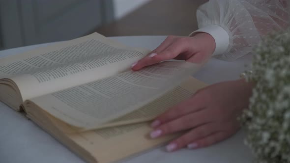 Bride Leafing Through the Pages of a Book