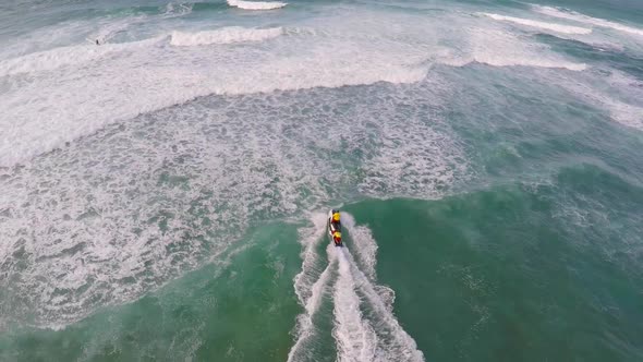 Aerial view of lifeguard surf rescue jet ski personal watercraft in Hawaii