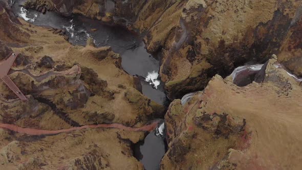 Cinematic aerial flyover of stunning Icelandic canyon.