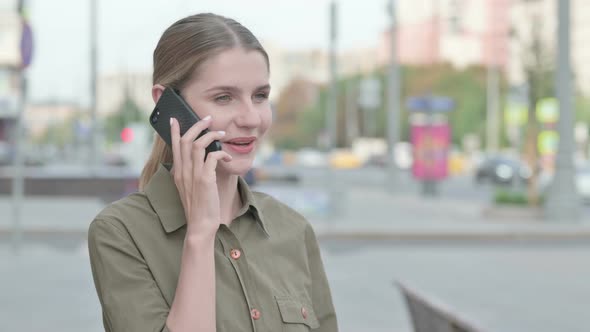 Woman Talking on Phone while Standing Outdoor