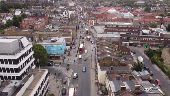 Shooting From a Drone From the Height of the Roadway Between the Rows of Houses