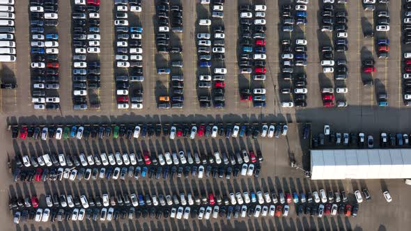 Aerial of a Automotive Car Terminal Parking Lot Storage Loading Area Ready for Distribution in the