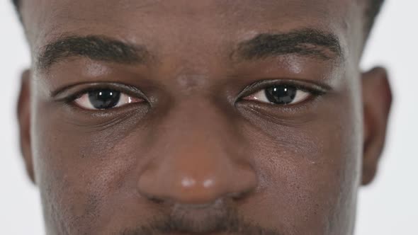 Close Up of Blinking Eyes of African Businessman