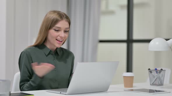 Young Woman Talking on Video Chat on Laptop