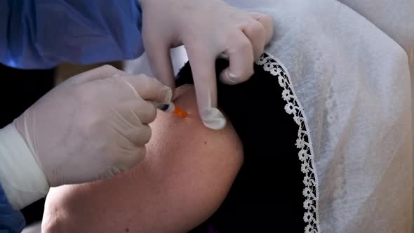 Woman Getting The COVID-19 Vaccine