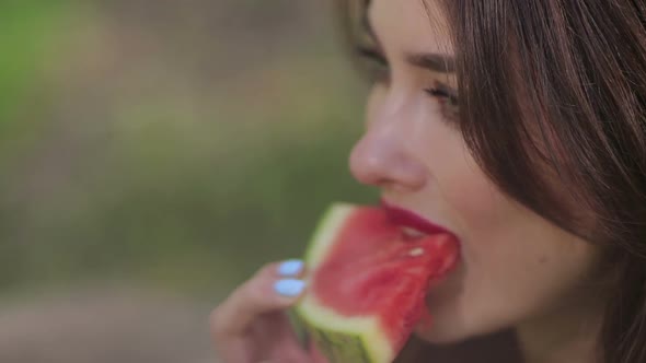 Pretty Woman Seductively Eating Watermelon